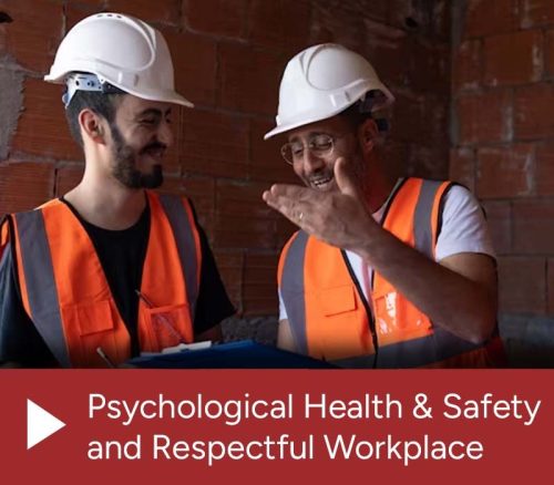 Two men wearing white hard hats and orange safety vests smile and talk in front of a brick wall. The text reads: "Psychological Health & Safety and Respectful Workplace".